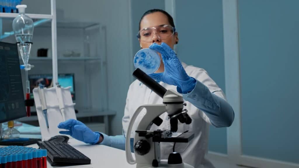 Chemistry scientist using research equipment in laboratory