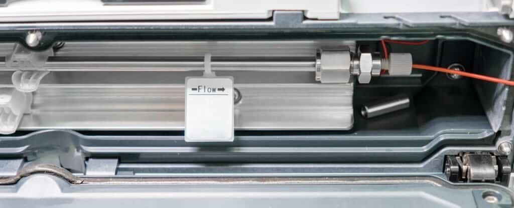 Column connected to HPLC system in termostate. HPLC system at analytical chemistry laboratory