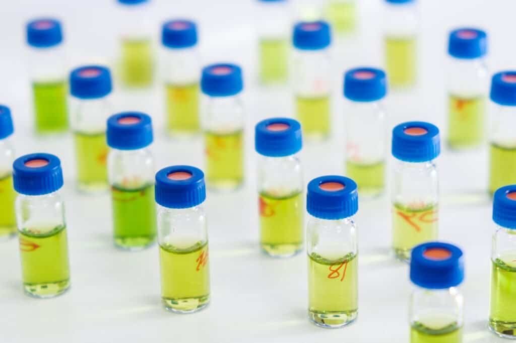 Pattern from HPLC glass vials with green fluid. Pharmaceuticals and chemical analysis