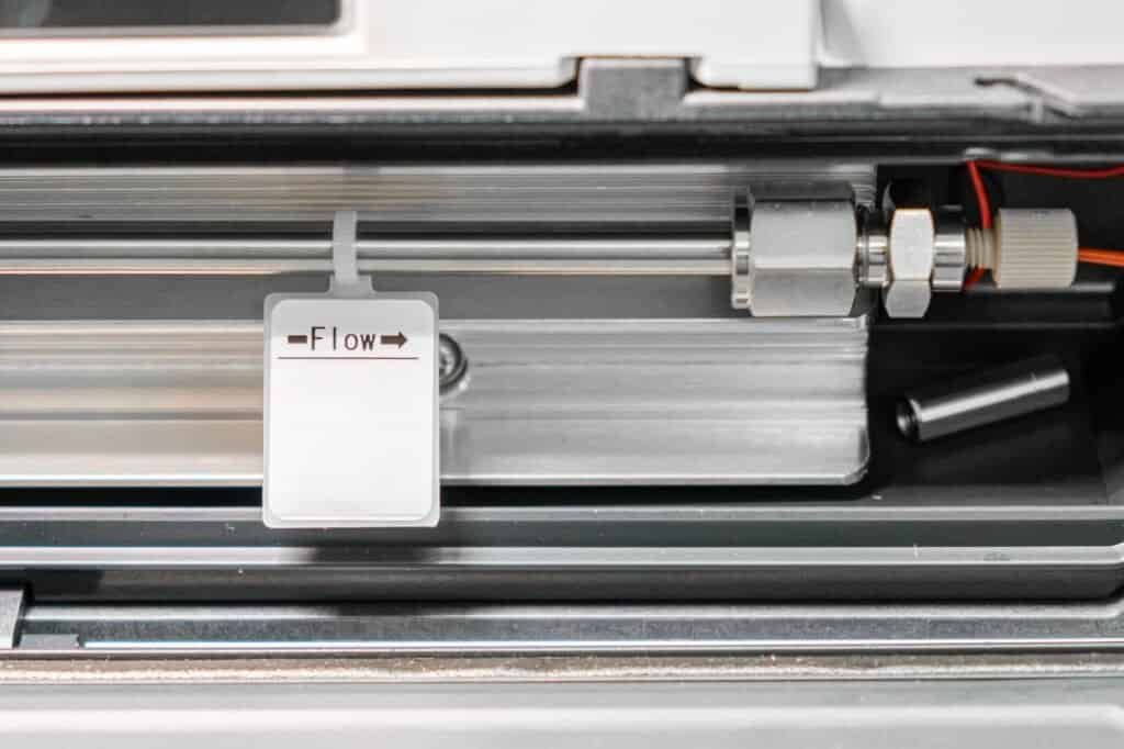 Column connected to HPLC system in termostate. HPLC system at analytical chemistry laboratory