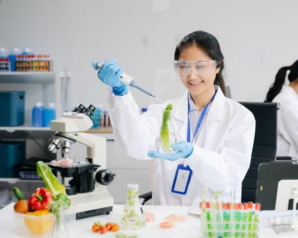 Food science as lab scientists test and analyze vegetables for safety